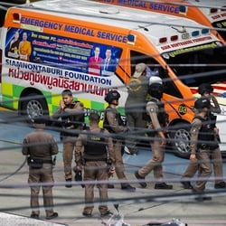 Thai police officers gather inside the compound of Debsirin Nonthaburi School, following a shooting incident at the school, in Bang Kruai district in Nonthaburi province.
