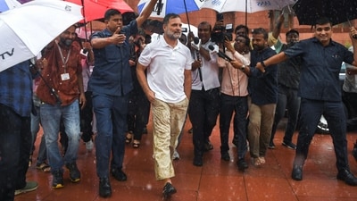 Lok Sabha LoP Rahul Gandhi leaves Parliament premises after attending the Monsoon Session amid rain, in New Delhi on Thursday. (ANI Photo)