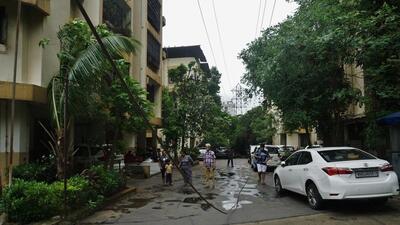 According to residents, the overhead power line has snapped several times over the past nine years, with live cables falling into the complex’s open walking and parking areas. (Praful Gangurde/HT Photo) According to residents, the overhead power line has snapped several times over the past nine years, with live cables falling into the complex’s open walking and parking areas. (Praful Gangurde/HT Photo)