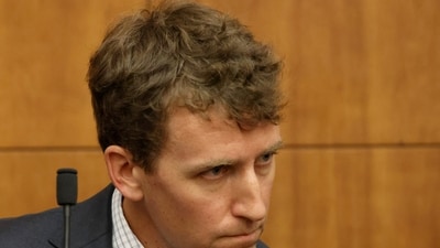 Patrick Clancy, the father of Cora, Dawson and Callan Clancy, looks on from the stand during Lindsay Clancy's murder trial. (REUTERS)