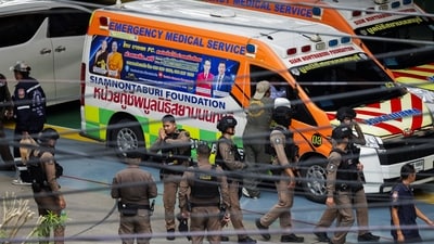 Thai police officers gather inside the compound of Debsirin Nonthaburi School, following a shooting incident at the school, in Bang Kruai district in Nonthaburi province. (REUTERS)