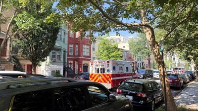 An ambulance is parked outside the home of Senator Mitch McConnell as police and fire vehicles block the street on the morning when he was reported to have been taken to the hospital in Washington, D.C., on June 14, 2026. (REUTERS/Bo Erickson)