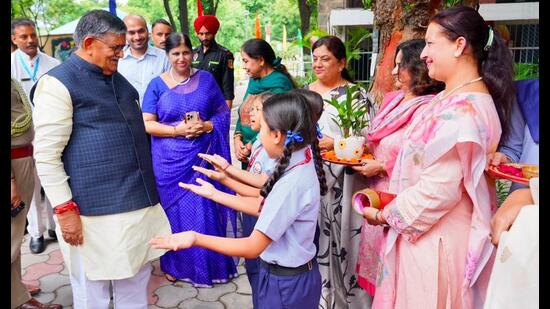 Administrator Gulab Chand Kataria being welcomed during an event in Sector 18, Chandigarh, on Friday.