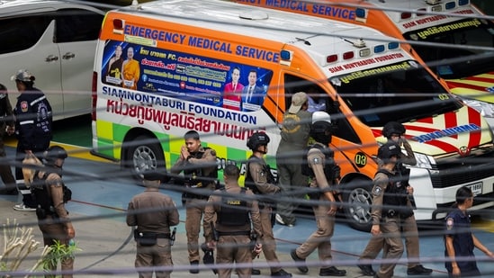 Thai police officers gather inside the compound of Debsirin Nonthaburi School, following a shooting incident at the school, in Bang Kruai district in Nonthaburi province.