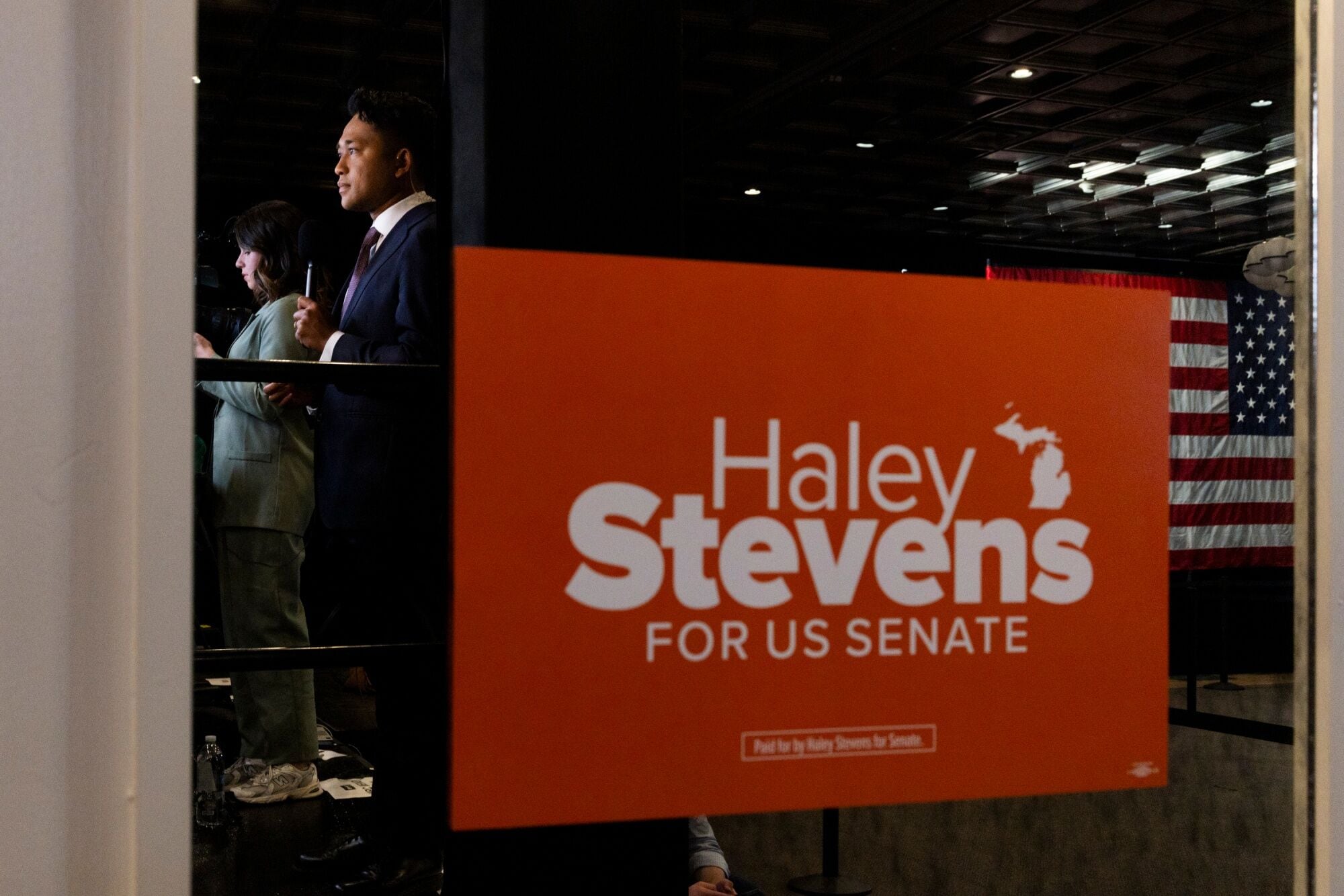 Members of the media reflected near campaign signage ahead of a primary election night watch party with Representative Haley Stevens, a Democrat from Michigan, in Detroit. (Bloomberg)