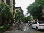 According to residents, the overhead power line has snapped several times over the past nine years, with live cables falling into the complex’s open walking and parking areas. (Praful Gangurde/HT Photo)