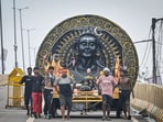 Gram it: Kanwariyas carrying containers filled with holy water collected from the Ganga River in Haridwar, during the annual Kanwar Yatra, spotted at Dilshad Garden with an elaborate tableau. The month-long celebrations of Sawan will end on August 11. (Photo: Sanchit Khanna/Hindustan Times)