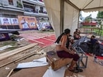 Workers take rest as preparations are underway ahead of LoP in Lok Sabha Rahul Gandhi's 'Chhatron Ki Goonj' programme.(PTI Photo)