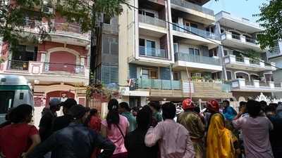 A crowd gathers outside the residential building after a fire broke out, killing nine people, at Vivek Vihar in New Delhi. (HT Photo) A crowd gathers outside the residential building after a fire broke out, killing nine people, at Vivek Vihar in New Delhi. (HT Photo)