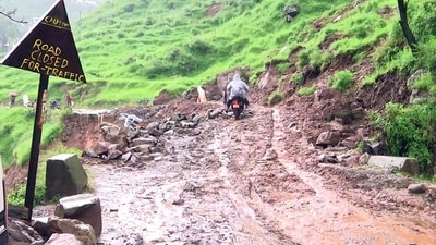 A bike wades through a muddy road following a landslide due to continuous heavy rainfall in Rajouri on Tuesday. (File Photo/ANI) A bike wades through a muddy road following a landslide due to continuous heavy rainfall in Rajouri on Tuesday. (File Photo/ANI)