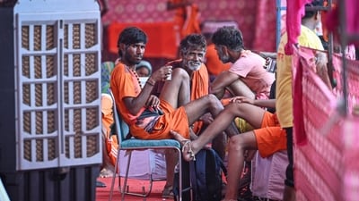 Kanwariyas take rest inside a temporary Kanwar Yatra camp (shivir) after collecting sacred Ganga Jal, as they pause during their onward journey to offer the holy water at Shiva temples. (HT Photos) Kanwariyas take rest inside a temporary Kanwar Yatra camp (shivir) after collecting sacred Ganga Jal, as they pause during their onward journey to offer the holy water at Shiva temples. (HT Photos)