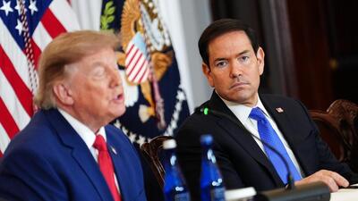 Secretary of State Marco Rubio listens as President Donald Trump speaks during a roundtable on the American mining industry on Friday at the State Department in Washington. (AP)