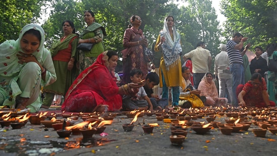 The panel led by Dr Radha Mohan Das Agrawal sought detailed information on the rehabilitation of displaced Hindu migrant populations. (In picture: Kashmiri Pandit devotees light earthen lamps during the annual Hindu festival in the Kheer Bhawani Temple)