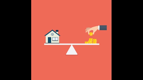 Home and stack of money on the scale (Getty Images/iStockphoto)