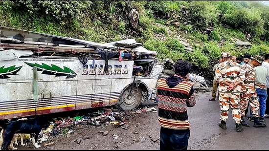 Mangled remains of the private bus after it overturned on the Bairagarh-Tissa road in Chamba on Saturday. (HT Photo)