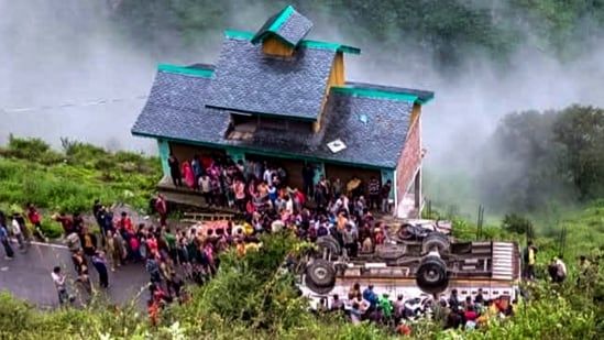 People gathered after a private bus overturned and plunged onto a lower road, in Chamba district, Himachal Pradesh, Saturday, Aug. 8, 2026. At least seven passengers were killed and 11 others were injured.