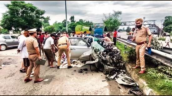 Police personnel at the site of an accident after a speeding car crashed into a stationary truck on the Jalandhar-Maksudan Bypass Highway, in Jalandhar on Saturday. (ANI Video Grab)