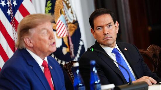 Secretary of State Marco Rubio listens as President Donald Trump speaks during a roundtable on the American mining industry on Friday at the State Department in Washington. (AP)