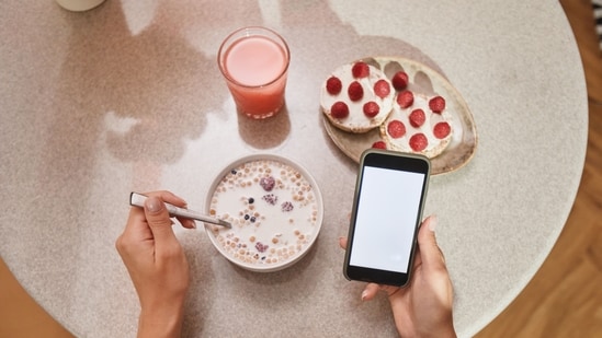 Dr Sethi warns against scrolling through the phone while eating, among other things.