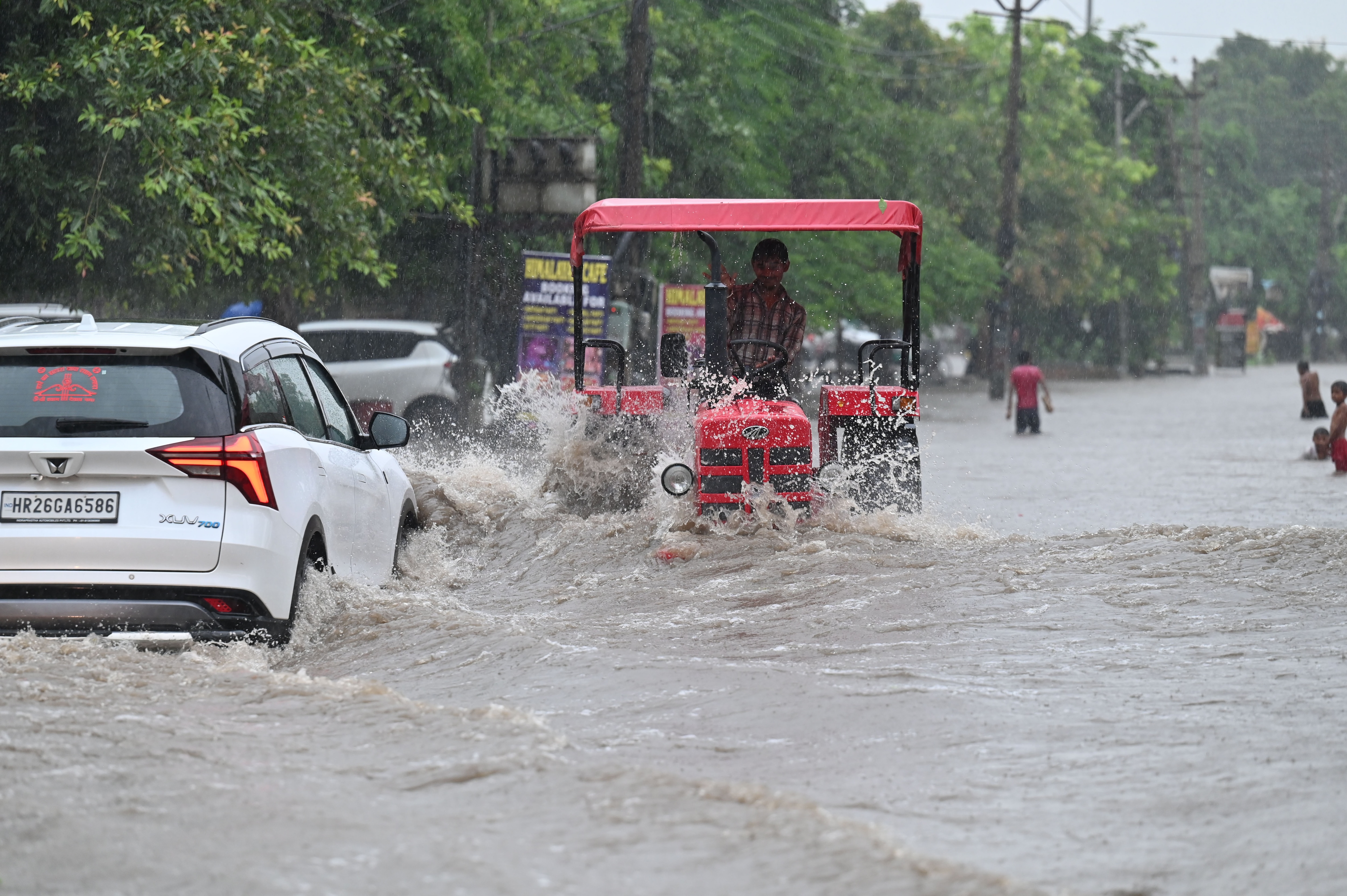 Vehicles wade through a waterlogged stretch following heavy monsoon rainfall on the Sector-10 road, in Gurugram, on Friday, 07 August 2026. (Parveen Kumar/HT) Vehicles wade through a waterlogged stretch following heavy monsoon rainfall on the Sector-10 road, in Gurugram, on Friday, 07 August 2026. (Parveen Kumar/HT)