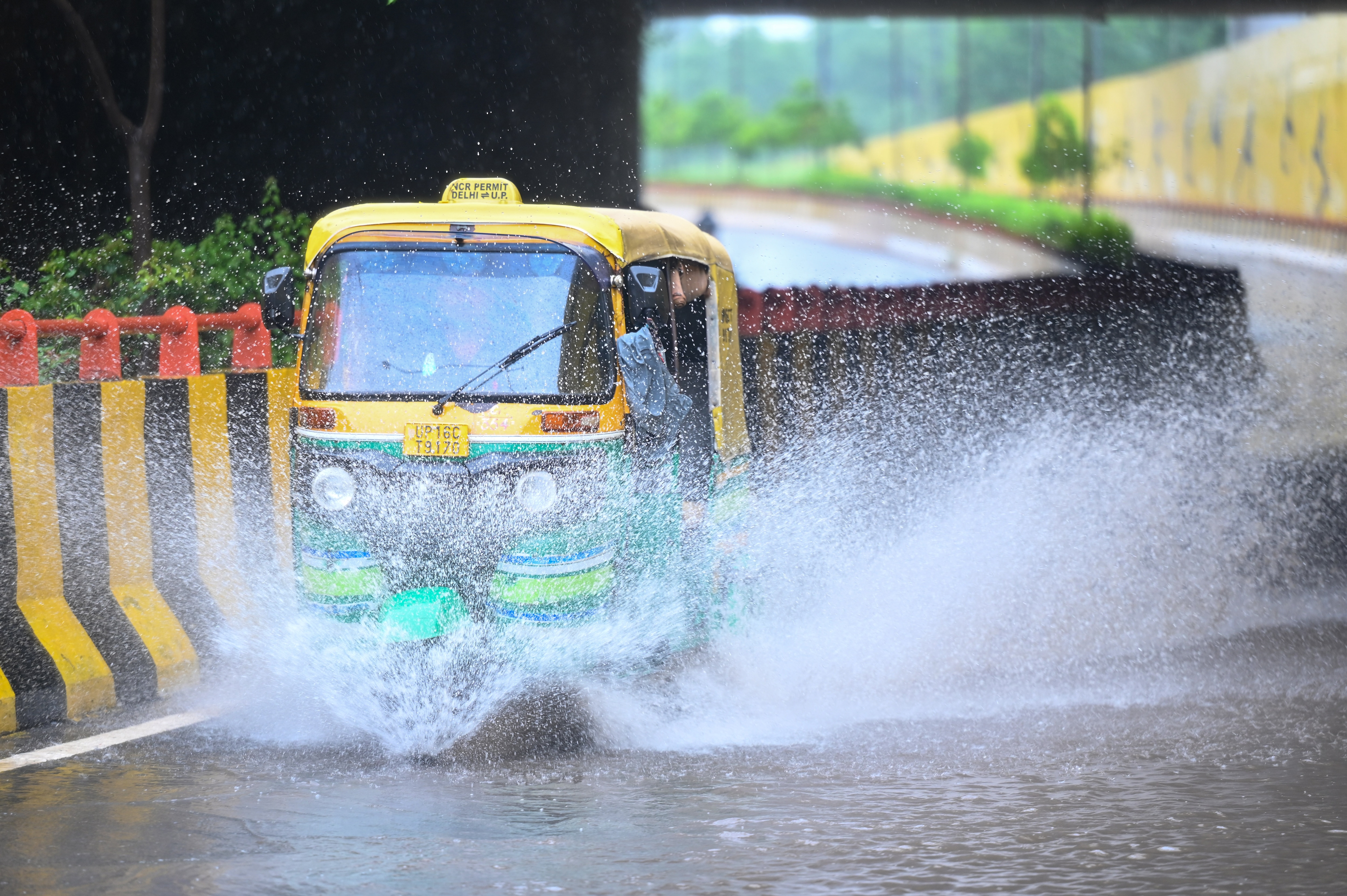 Commuters making their way through a waterlogged path at the Sector 96 underpass following heavy rain, in Noida, India, on Friday, August 07, 2026. (Sunil Ghosh/HT) Commuters making their way through a waterlogged path at the Sector 96 underpass following heavy rain, in Noida, India, on Friday, August 07, 2026. (Sunil Ghosh/HT)