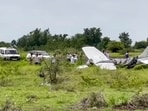 Baramati: Local residents and officials gather around the wreckage of a trainer aircraft that crash-landed near the airstrip at Baramati Airport, in Pune district, Maharashtra, Sunday, Aug. 9, 2026.