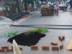 Caved in road at Karamyogi Enclave in Agra on Friday. (HT PHOTO)