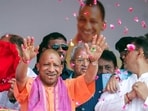Chief minister Yogi Adityanath showering flowers on Kanwariyas in Meerut on Saturday. (ANI PHOTO) Chief minister Yogi Adityanath showering flowers on Kanwariyas in Meerut on Saturday. (ANI PHOTO)