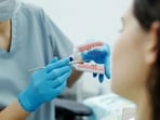 Bleeding gums may indicate inflammation linked to cardiovascular disease, according to Dr. Mark Burhenne.(Unsplash)