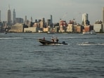 The 22-foot Bayliner speedboat overturned near Liberty Island.