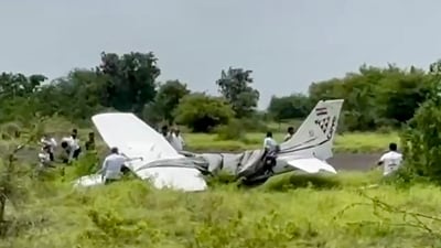 Baramati: Local residents and officials gather around the wreckage of a trainer aircraft that crash-landed near the airstrip at Baramati Airport, in Pune district, Maharashtra, Sunday, Aug. 9, 2026. (PTI) Baramati: Local residents and officials gather around the wreckage of a trainer aircraft that crash-landed near the airstrip at Baramati Airport, in Pune district, Maharashtra, Sunday, Aug. 9, 2026. (PTI)