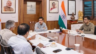 Union Minister for Consumer Affairs, Food and Public Distribution Pralhad Joshi, center, chairs a review meeting with the Secretary and senior officials of the Department of Food and Public Distribution to assess sugar stock positions and production levels, in New Delhi. (PTI)
