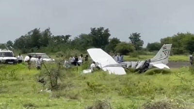 A trainer aircraft of a private company near the Baramati airstrip in Maharashtra's Pune district, after a mishap during landing. (Video Grab via PTI) A trainer aircraft of a private company near the Baramati airstrip in Maharashtra's Pune district, after a mishap during landing. (Video Grab via PTI)