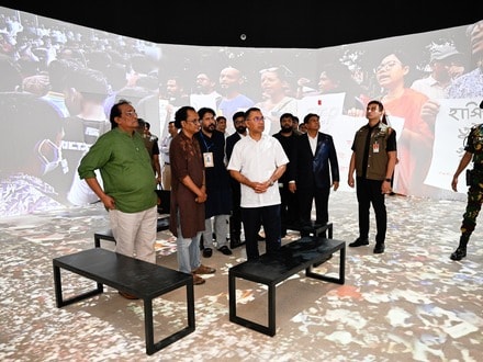 Bangladesh's Prime Minister Tarique Rahman, center, looks at an exhibit at the inauguration of a museum which will serve as a memorial for those killed during the mass uprisings in July 2024, at the former residence of Bangladesh's ousted leader Sheikh Hasina, in Dhaka, Bangladesh, Wednesday, Aug. 5, 2026. (AP Photo/Mahmud Hossain Opu)