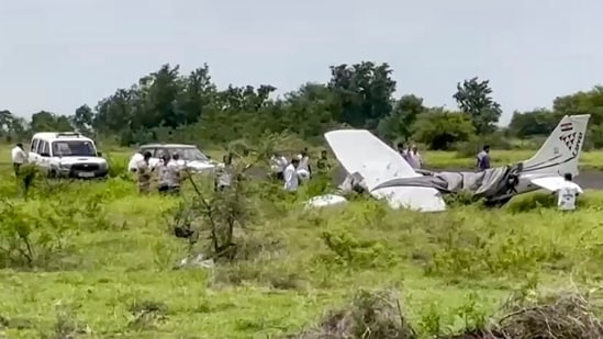 Baramati: Local residents and officials gather around the wreckage of a trainer aircraft that crash-landed near the airstrip at Baramati Airport, in Pune district, Maharashtra, Sunday, Aug. 9, 2026.