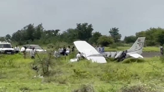 A trainer aircraft of a private company near the Baramati airstrip in Maharashtra's Pune district, after a mishap during landing. (Video Grab via PTI)