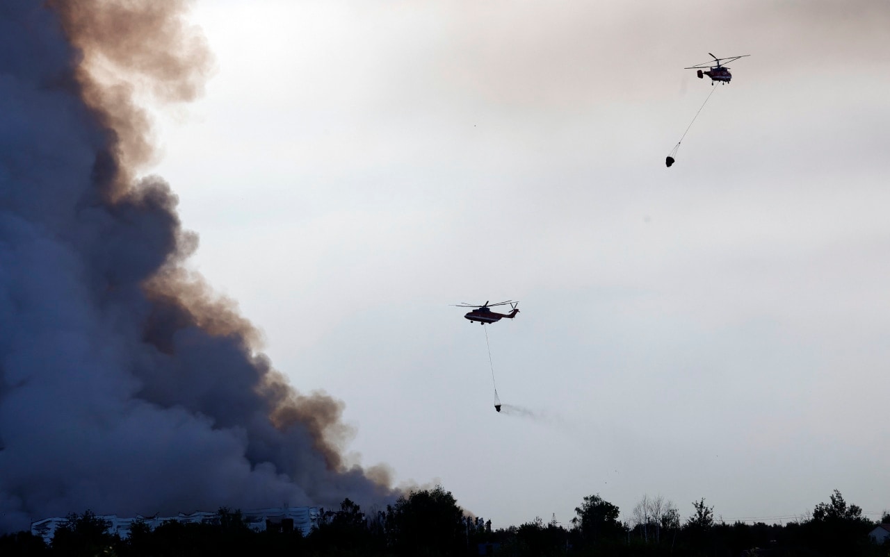 Helicopters last month attempting to extinguish a fire at a Wildberries logistics complex outside Moscow. Helicopters last month attempting to extinguish a fire at a Wildberries logistics complex outside Moscow.