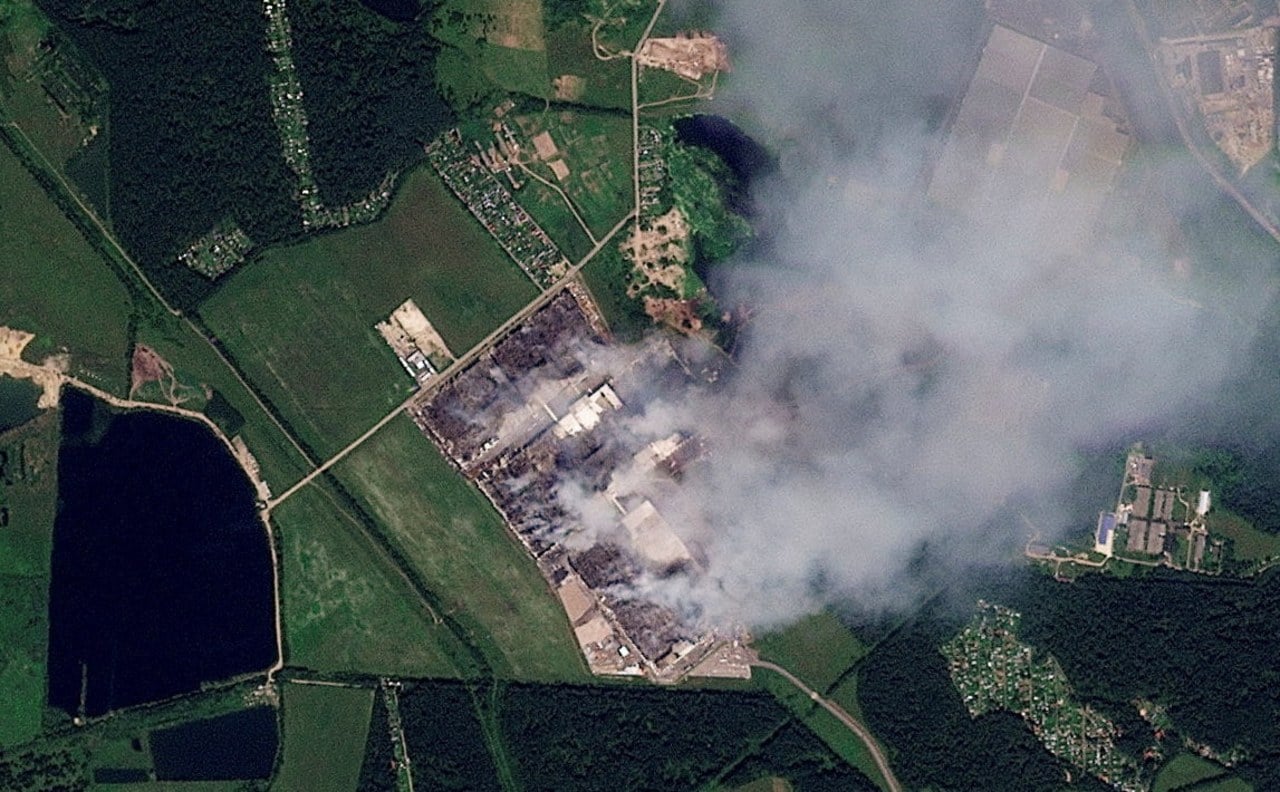 A satellite view shows smoke rising at a Wildberries facility near Moscow in July. A satellite view shows smoke rising at a Wildberries facility near Moscow in July.