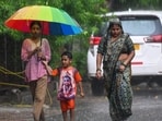 Commuters were seen moving about during the rain in the afternoon in Noida.