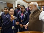 Prime Minister Narendra Modi offers sweet to Commonwealth Games 2026 Gold Medalist in the women's 48kg weightlifting event Mirabai Chanu(DPR PMO)