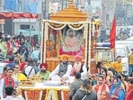 Devotes with a palanquin during a procession carried out on the eve of Sri Guru Ravidas Jayanti in Jalnadhar, Punjab. (HT File)