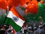 A volunteer holds an Indian national flag during a tricolour campaign in Kolkata on August 10, 2026 ahead of country's 80th Independence Day on August 15.(AFP)