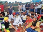 Kin of murder victim during the protest on the national highway near Basti Jodhewal in Ludhiana on Sunday. (Gurpreet Singh/ht)