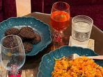 Nestasia wine goblets, textured glasses and blue serving plates bring colour, character and a hosting feel to everyday meals at home. (Hindustan Times)