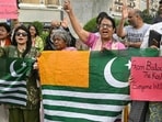 Women's rights activists shout slogans during a protest in Karachi following unrest during the first phase of polling for the local legislature in Pakistan-occupied Kashmir.(AFP)