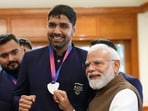 Prime Minister Narendra Modi with boxer Narender Berwal during a felicitation ceremony for India's Glasgow 2026 Commonwealth Games contingent at the Prime Minister's residence