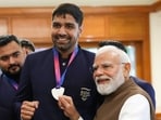 Prime Minister Narendra Modi with boxer Narender Berwal during a felicitation ceremony for India's Glasgow 2026 Commonwealth Games contingent at the Prime Minister's residence in New Delhi.(Photo: PMO/PTI)