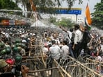Police personnel deploy water cannons to disperse student protesters in Ranchi on Monday.(PTI)