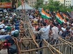 Security personnel try to stop student protesters and job aspirants marching towards the Jharkhand legislative assembly in Ranchi on Monday, August 10, 2026.(PTI Photo)