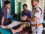 A police official interacts with an injured victim after some miscreants opened fire from Arunachal Pradesh along the inter-state border, leaving at least eight Assam residents injured in this incident, in Dhemaji district, Assam, Monday, Aug. 10, 2026. (PTI)